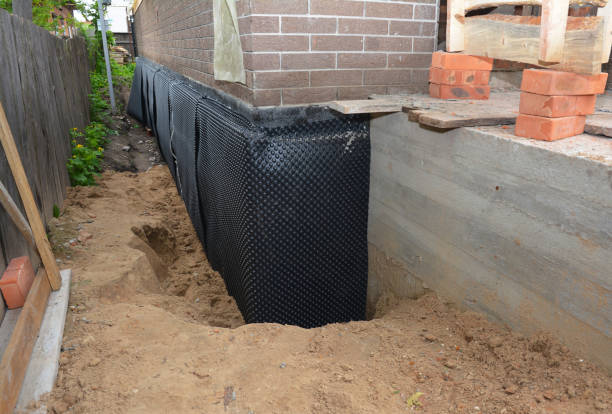 Happy homeowners after waterproofing job in Seaman